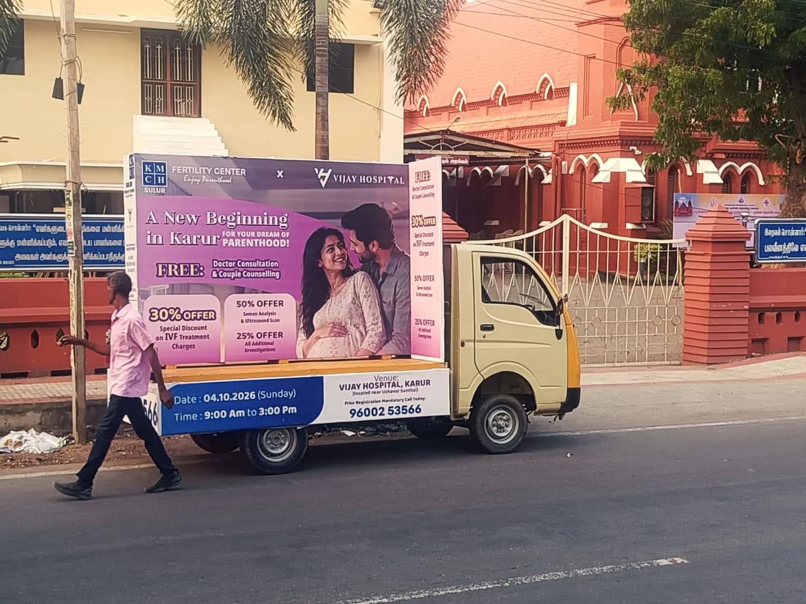 Side view of mobile ad van with fertility clinic panel