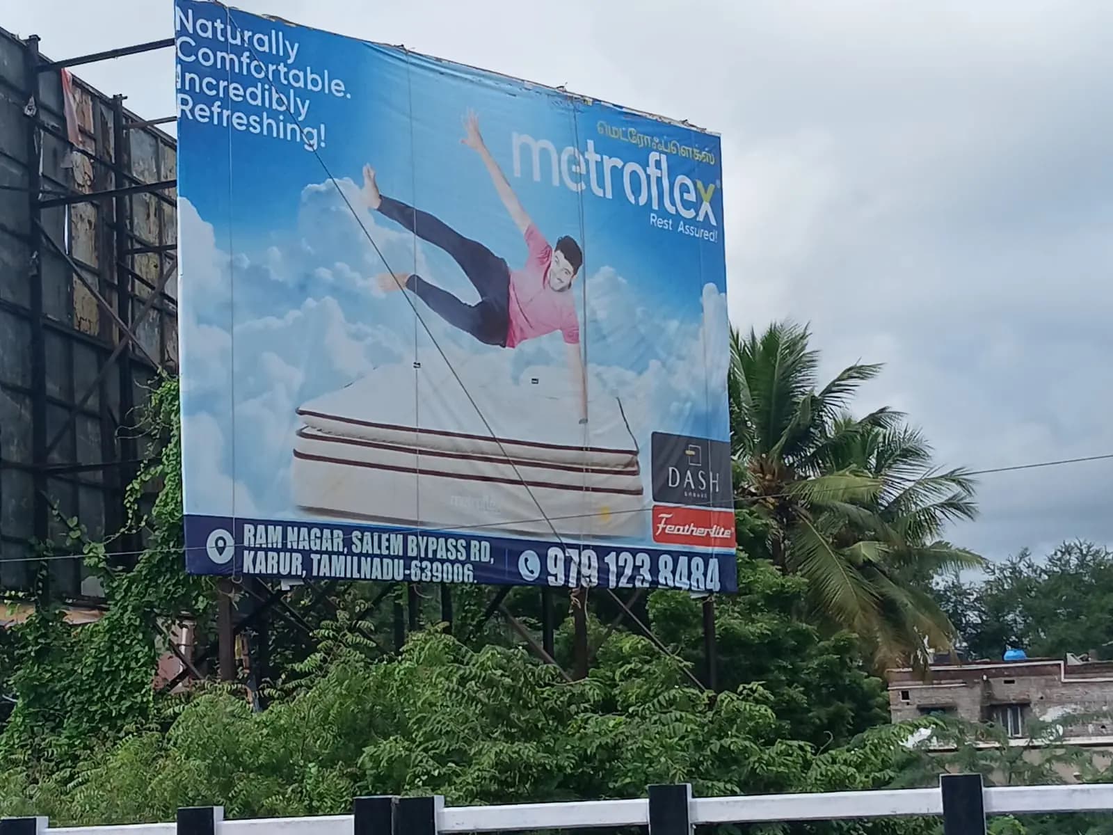 Hoarding showing a woman relaxing, against a blue sky