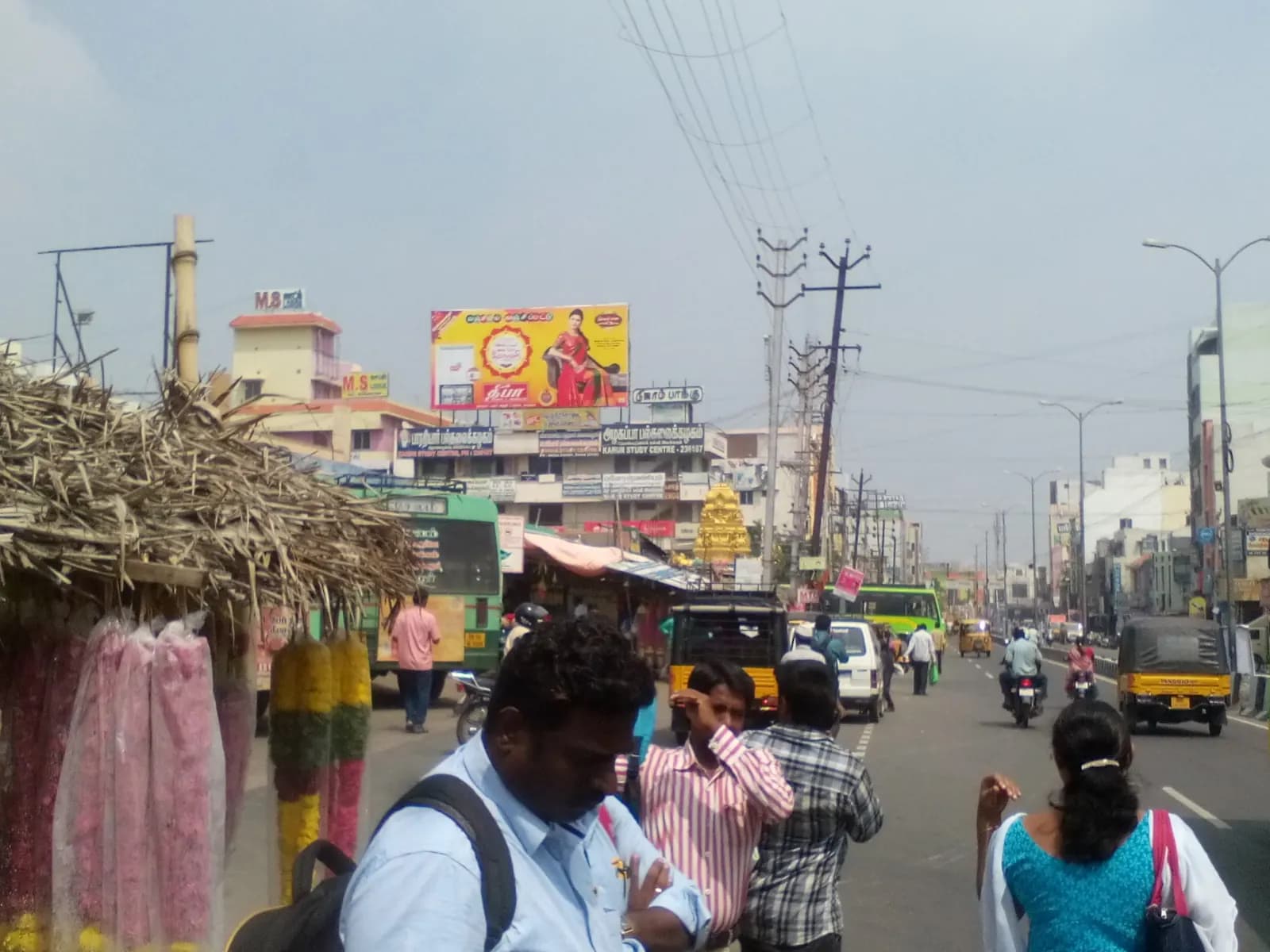 Large 40 by 20 foot roadside hoarding near a mini bus stand