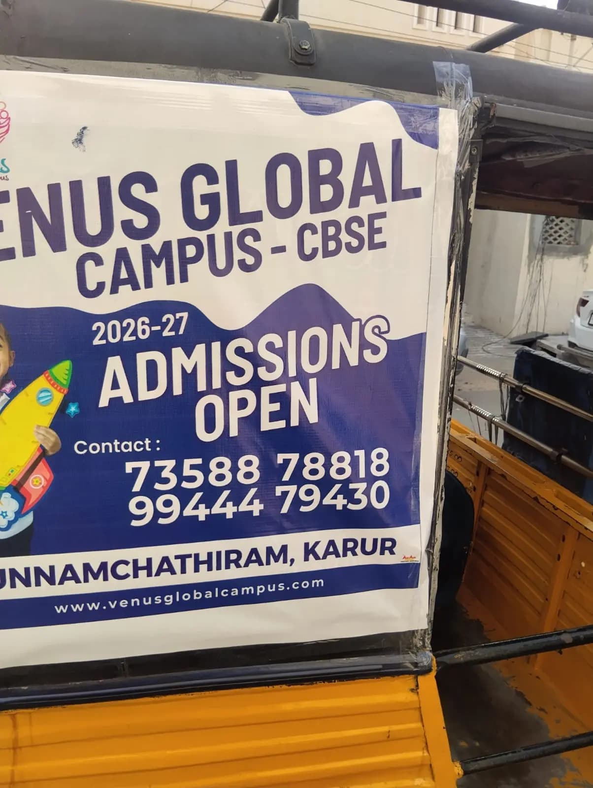 Venus Global Campus admissions ad on auto-rickshaw back panel