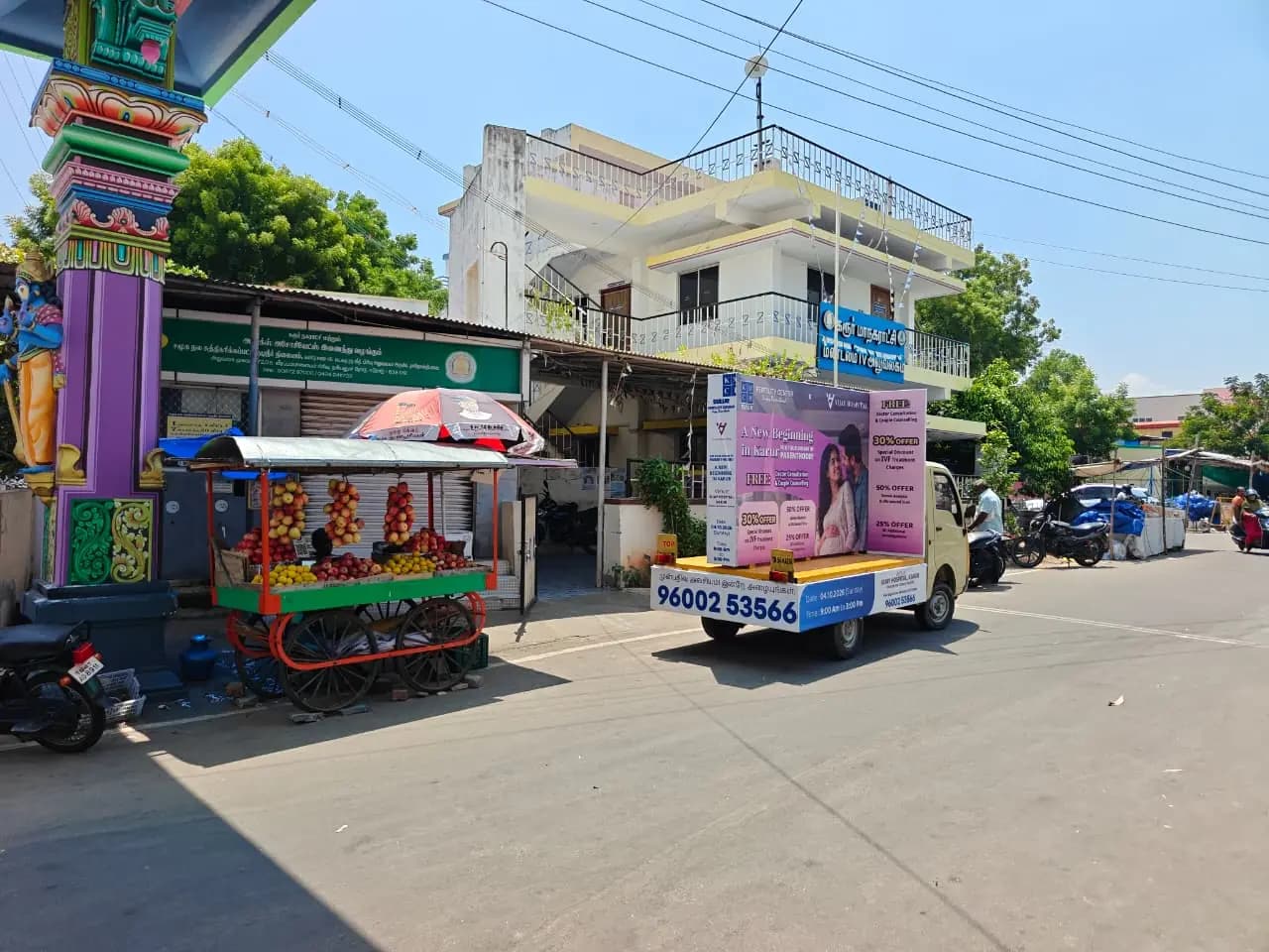 Mini-truck mobile ad van with flex banners on street