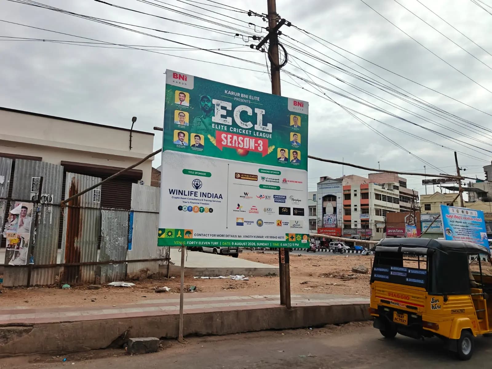 ECL Season 3 hoarding at roadside junction with auto