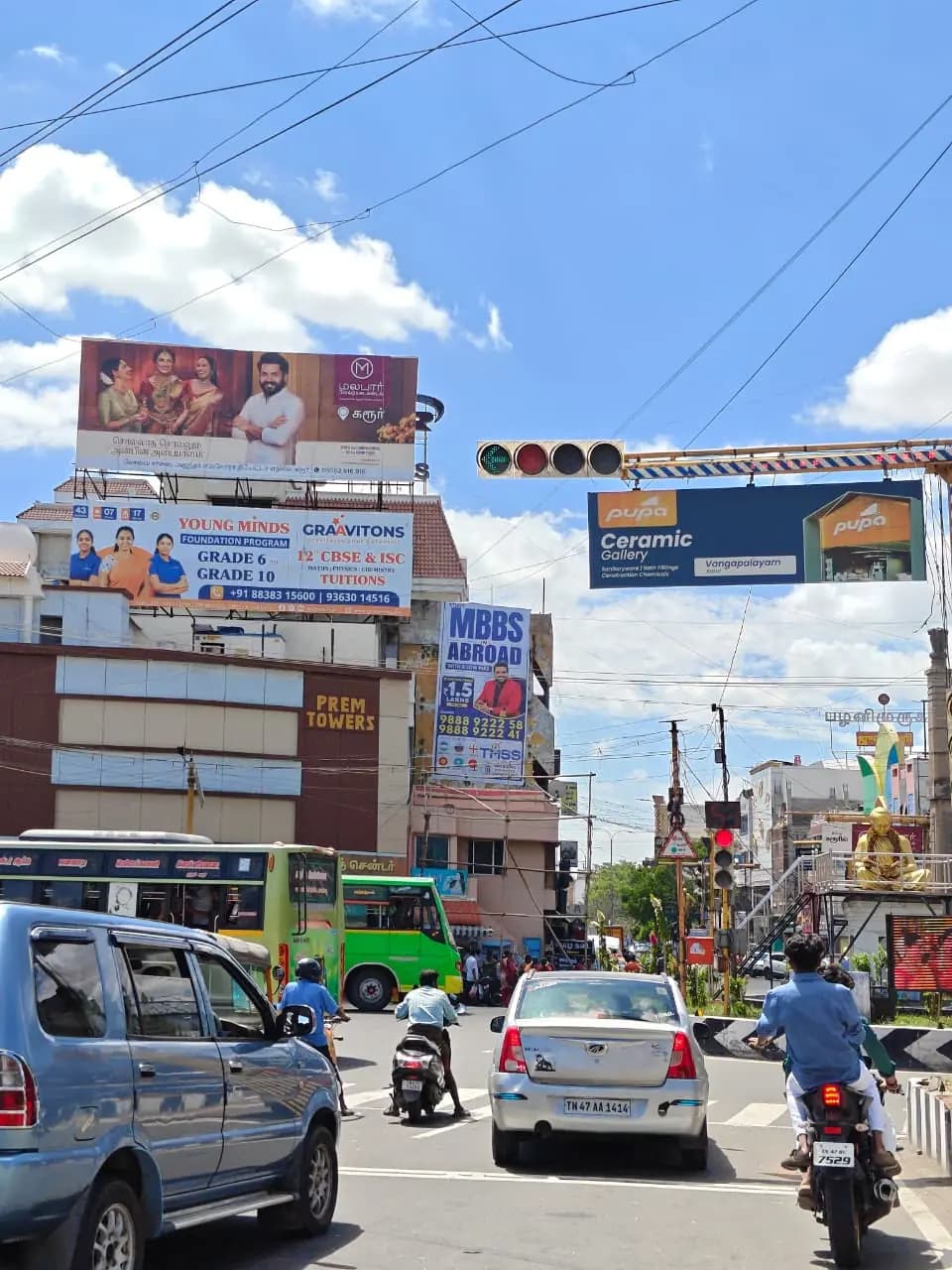 Multiple building-top hoardings over traffic signal junction