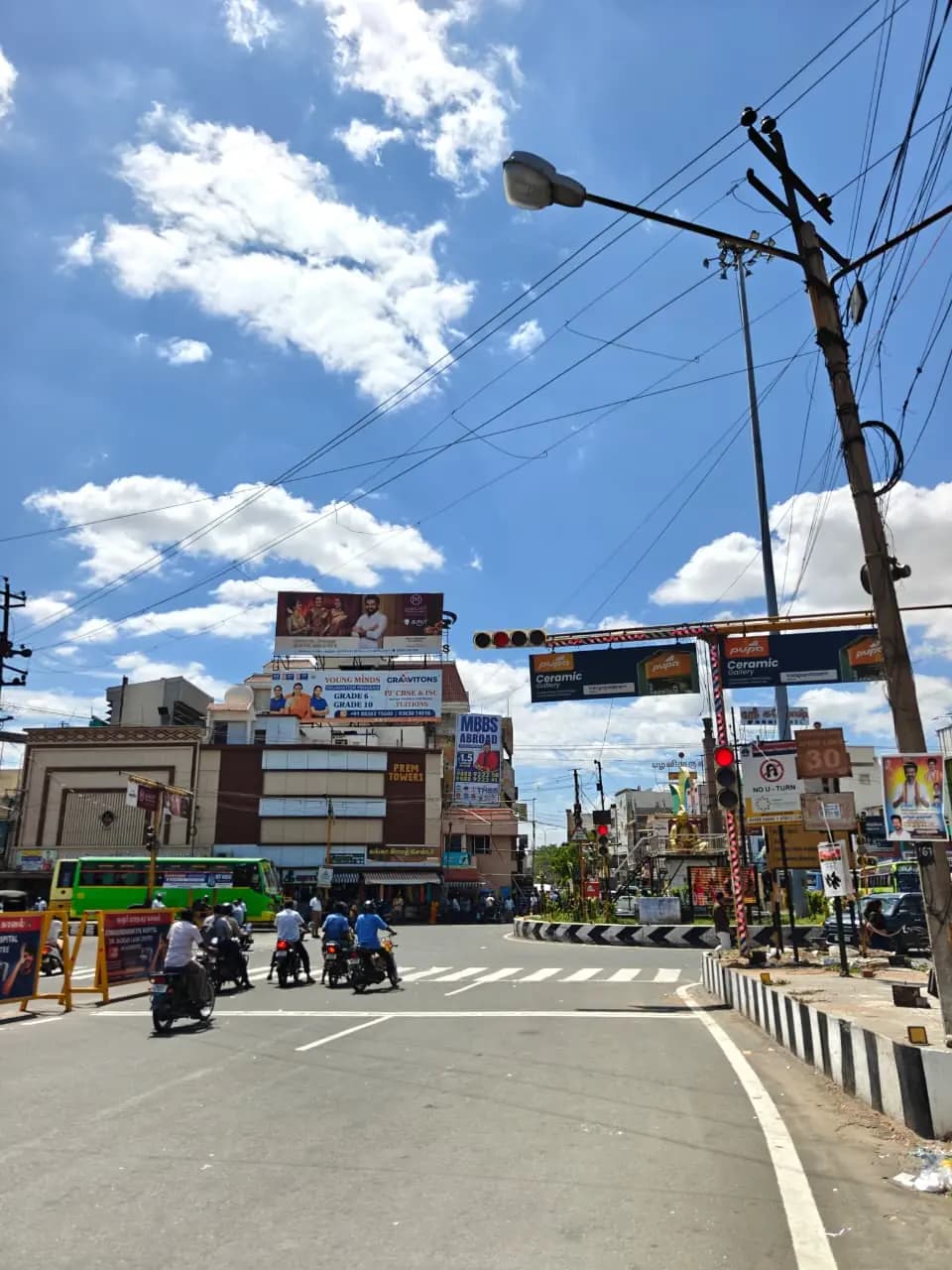 Junction view with rooftop hoardings and signal gantry boards