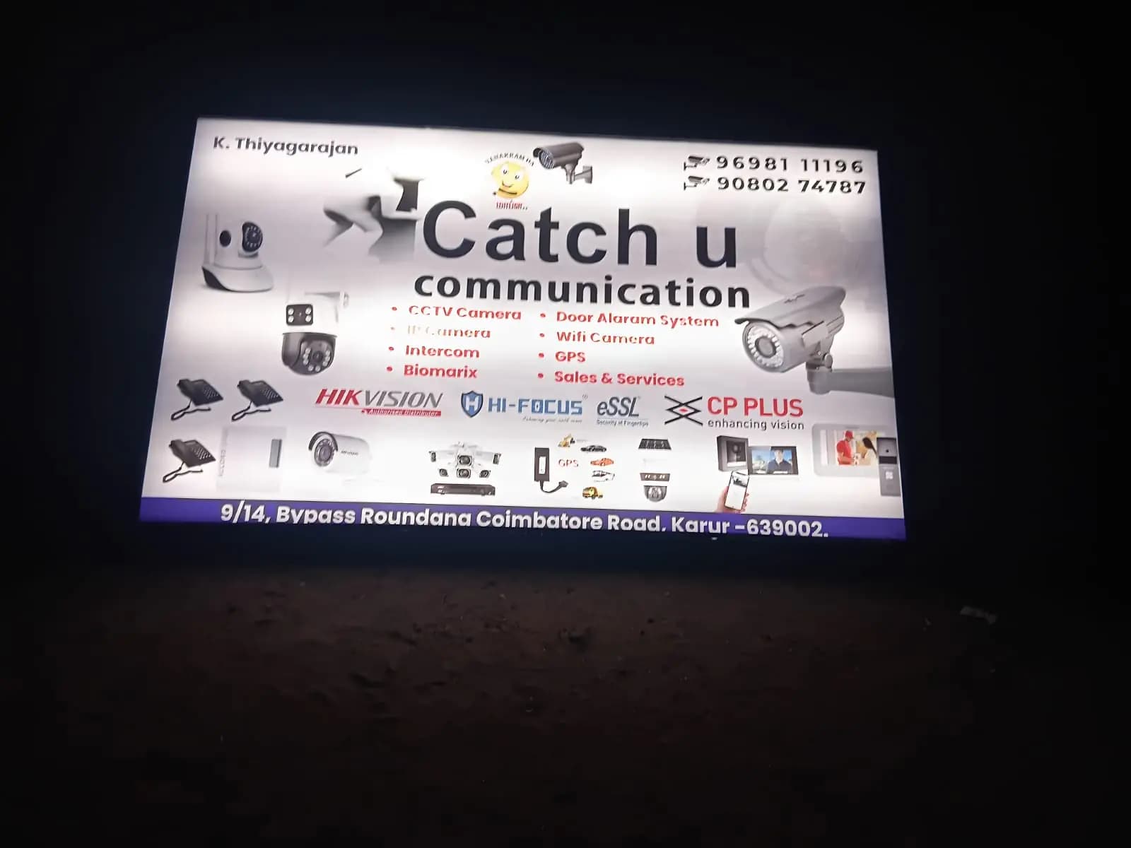 Illuminated shop name board at night