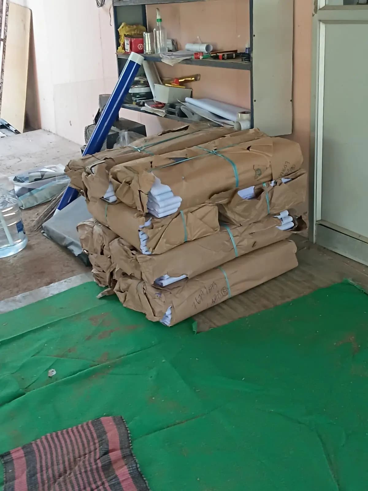 Wrapped bundles of printed pamphlets on floor