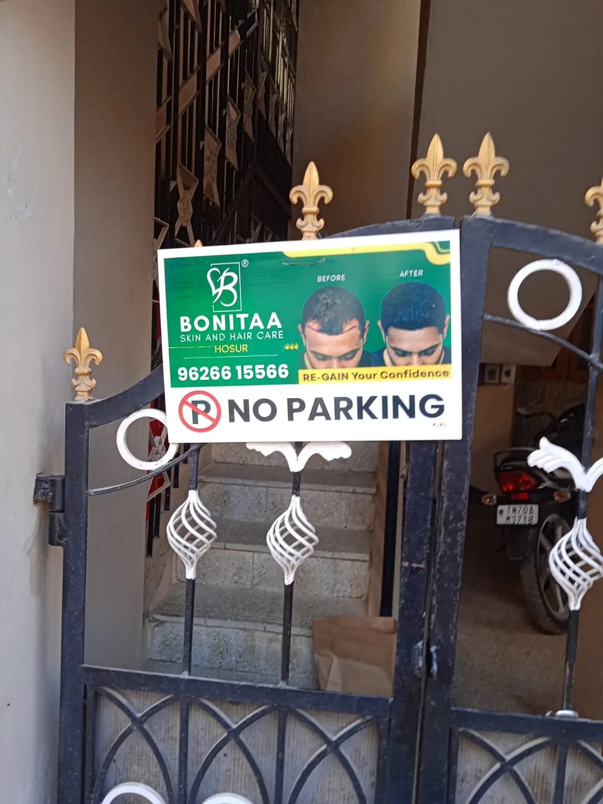 Sponsored 'No Parking' board on house gate