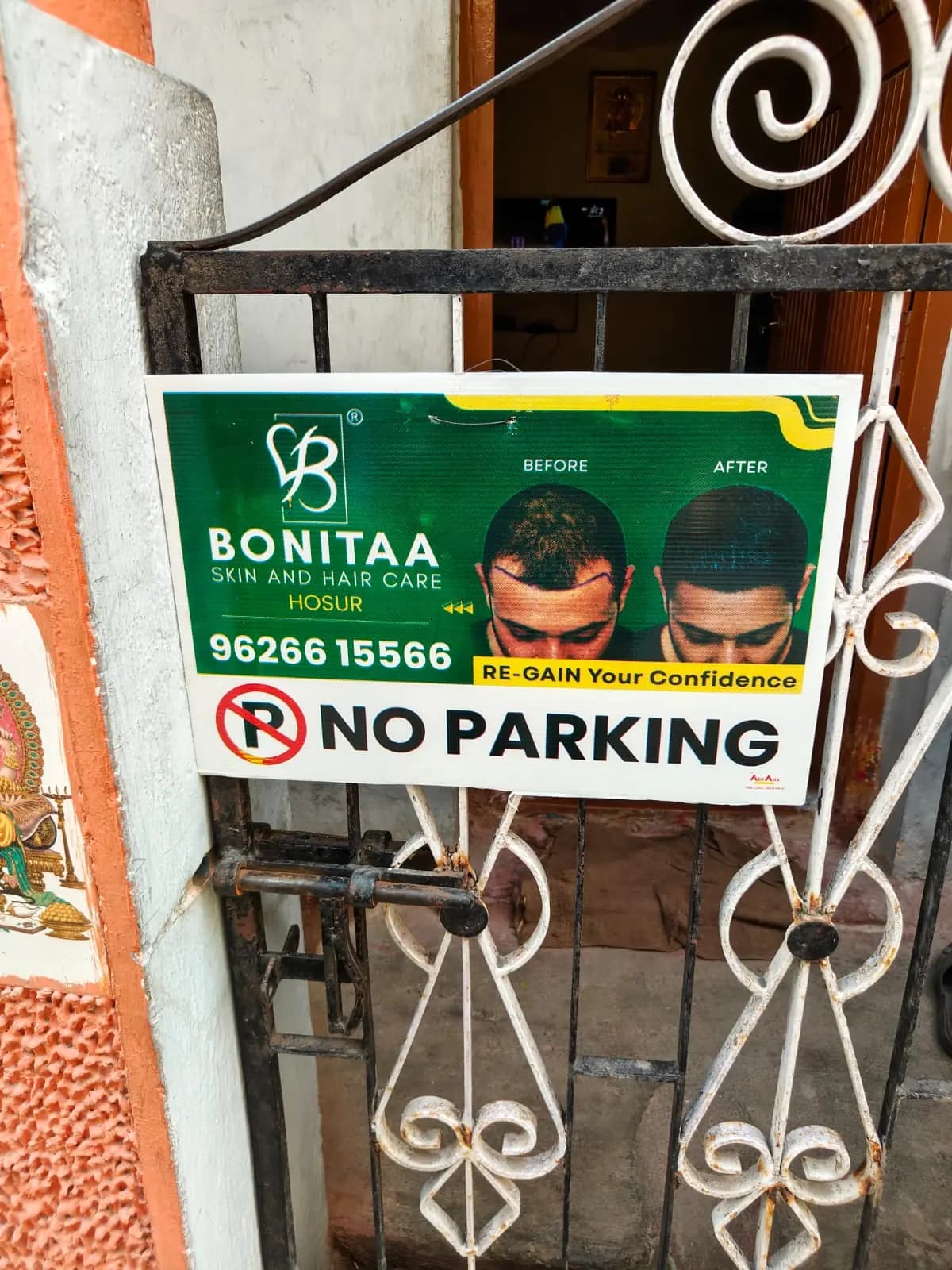 Sponsored No Parking board on house gate